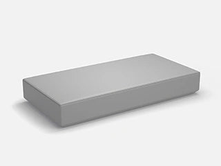 A rectangular, gray 3D seat module without armrests for a modular sofa system, shown on a white background for customization.