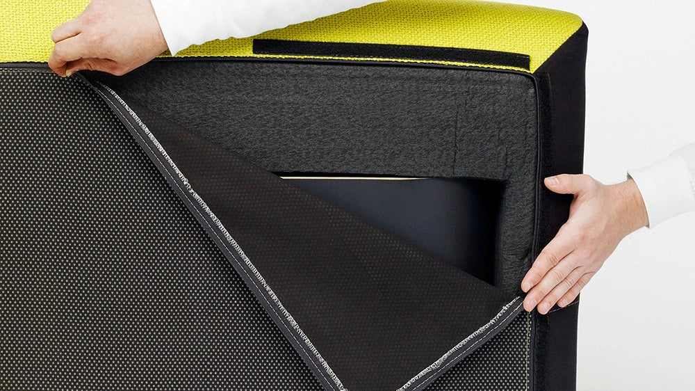 Close-up of the underside of a yellow Cubit sofa module with the zipper open