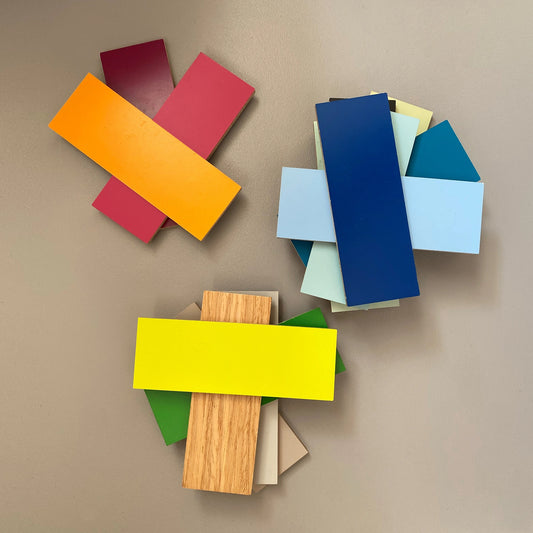 Arrangement of different paint samples and material samples for planning individual shelves