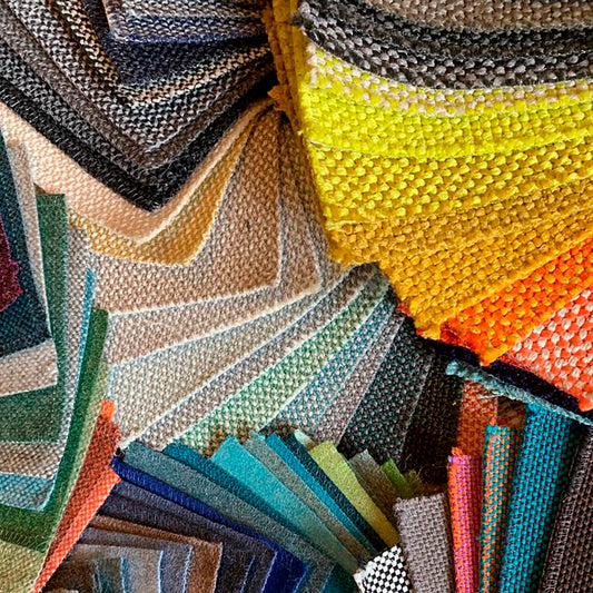 Large selection of fabric samples - sorted by colours and textures